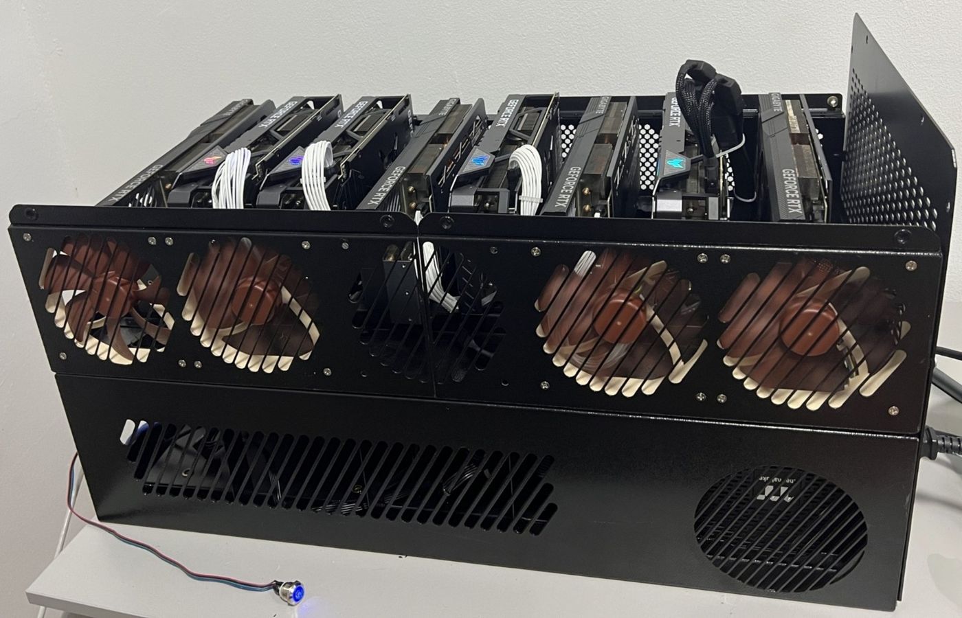 Open 19-inch steel chassis built for eight GPUs, with motherboard tray and fan wall